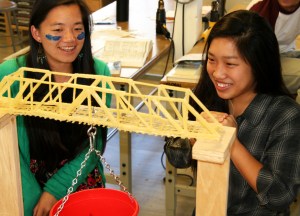 Two Girls Smiling at Pasta Bridge